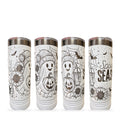 Four views of a white skinny tumbler laser engraved with a full-wrap Spooky Season ghost and sunflowers design, on a white background